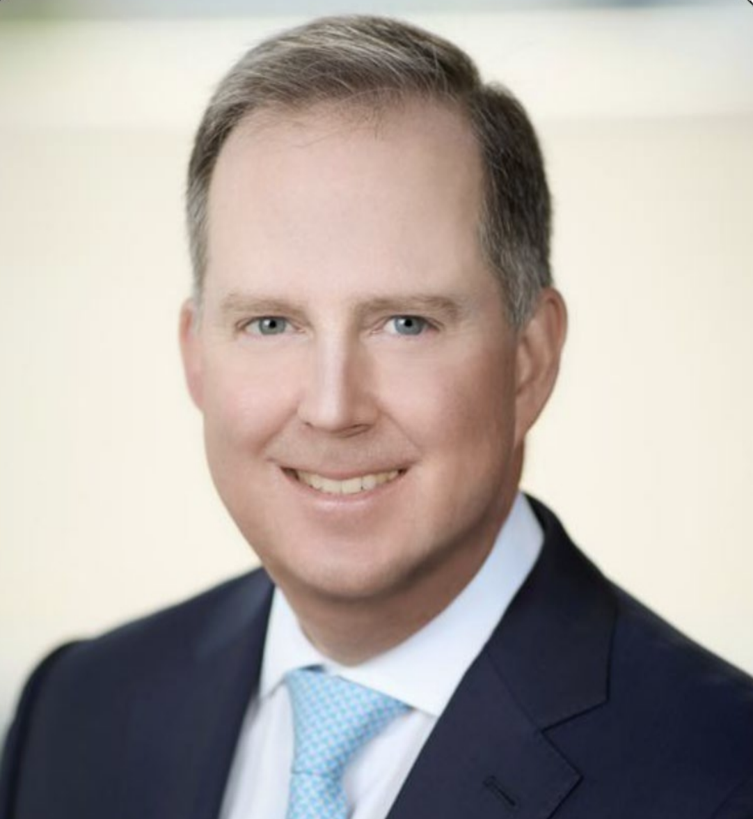 White male wearing suit and tie